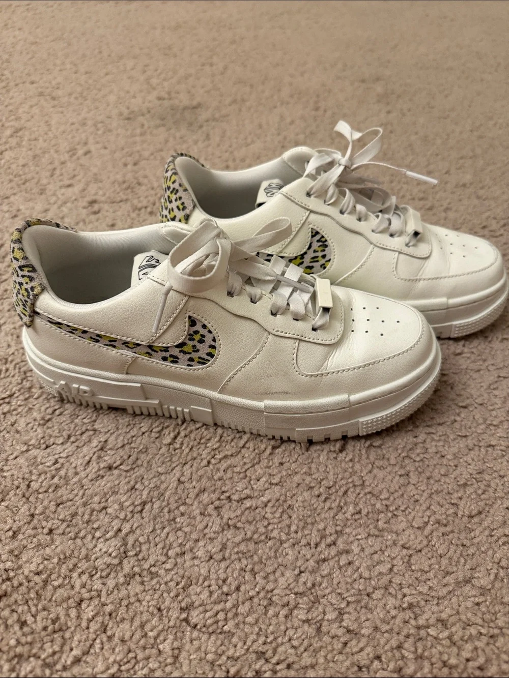 Nike Cream Sneakers with Leopard-Pattern Swoosh and Heel